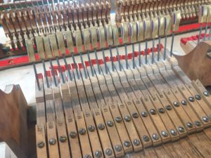 photo of piano keys with rocker capstans