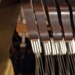 photo of piano strings and hammers